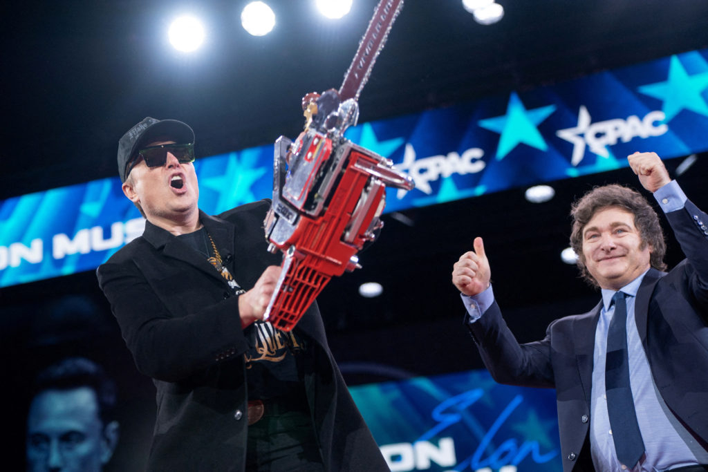 Elon Musk displays a chainsaw given to him by President of Argentina Javier Milei during the Conservative Political Action Conference (CPAC) in National Harbor, Maryland, U.S., February 20, 2025. REUTERS/Nathan Howard TPX IMAGES OF THE DAY